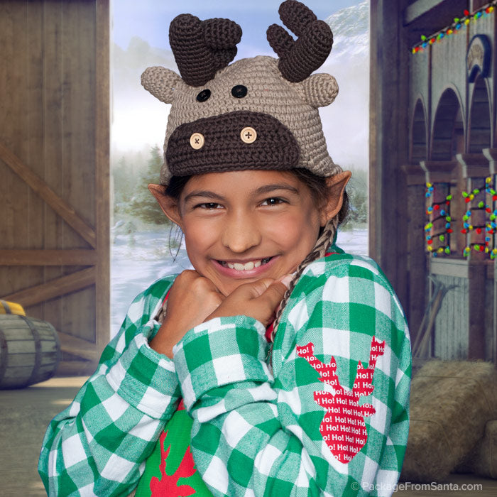 Package From Santa® - Child looking like an elf and wearing a Reindeer Hat.